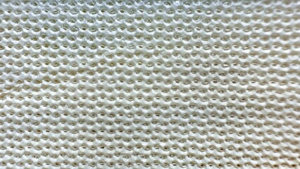 white honeycomb mesh texture macro closeup with geometric holes and glossy surface pattern ideal for modern wallpaper or digital banner background
