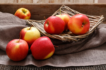 Red apples in wicker basket.