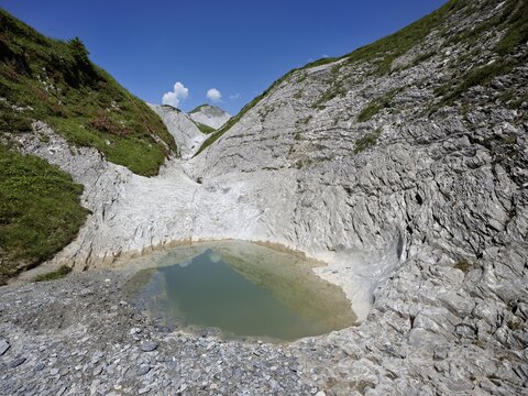 Glacier mill with glacier pots on the Trinser Alp Mora, Trin, Canton Graub&uuml;nden, Switzerland