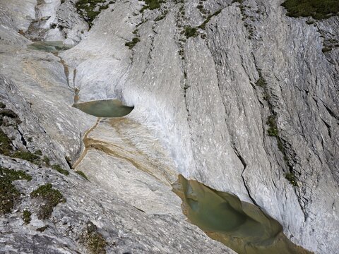 Glacier mill with glacier pots on the Trinser Alp Mora, Trin, Canton Graub&uuml;nden, Switzerland