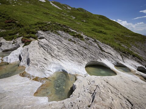 Glacier mill with glacier pots on the Trinser Alp Mora, Trin, Canton Graub&uuml;nden, Switzerland