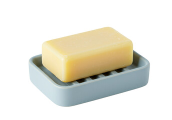 透明な背景に配置された石鹸と石鹸皿のクローズアップ写真 黄色の石鹸と青い石鹸皿のミニマリストなデザイン