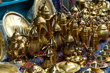 Brass items on a table in the market of Old Acre, Akko Israel.
