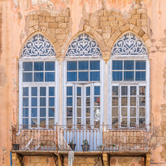 Interesting windows in Acre, Akko, Israel on a sunny day.
