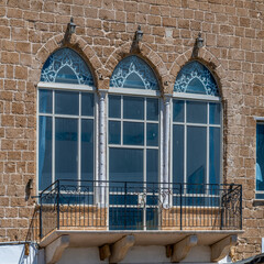 Interesting windows in Acre, Akko, Israel on a sunny day.
