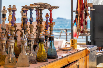 Hookah, Nargila pipes standing on the table of an outdoor cafe in in the walled city of Old Acre, Akko Israel.
