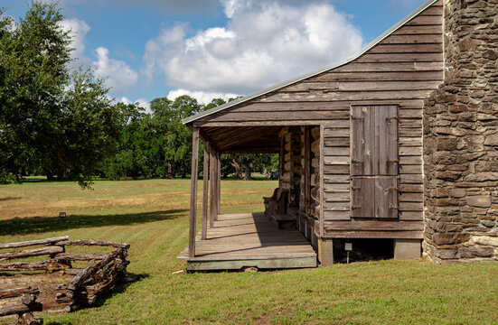 old abandoned wooden farmhouse with porch