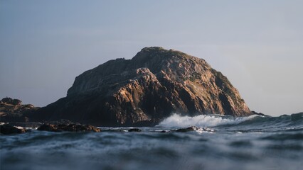 Rugged Coastal Rock Formation Bathed in Golden Hour Light