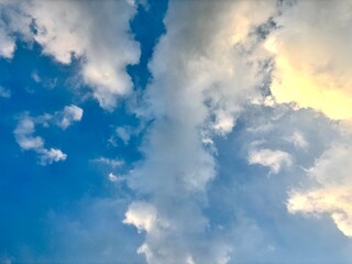 Vibrant blue sky meets fluffy white cumulus clouds creating a serene and ethereal skyscape perfect for conveying tranquility freedom and the beauty of a summer's day ideal for backgrounds