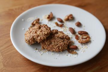 Cookies with nuts on a white plate