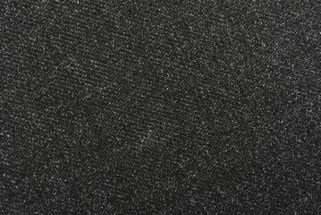 Obraz premium Texture of dense black fabric for tailoring. Canvas. Textile