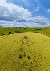 Aerial view of a mysterious, intricate, geometric crop art, crop circle formation in a barley field near Sutton Veny, Wiltshire, England, UK 