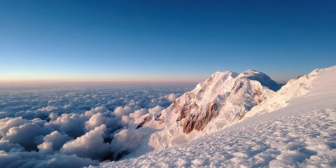Naklejka premium Mountain Climbing Concept. Majestic mountain peak above a sea of clouds at sunrise.