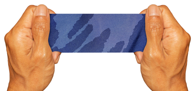 Man Hand Holding Blue Fabric Texture Pieces on Transparent Background. Ideal for Text Space or Creative Project.