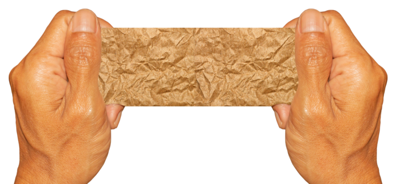 Man Hand Holding Torn Brown Crumpled Paper Texture Pieces on Transparent Background. Ideal for Text Space or Creative Project.