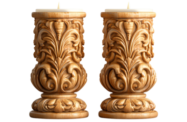 a pair of beautifully carved candles with ornate designs, isolated on a transparent background.