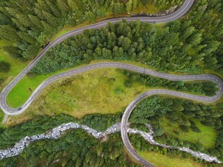 Winding Mountain Road Through Lush Forest – Aerial View