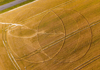 Aerial view of a mysterious, intricate, geometric crop art, crop circle formation in a wheat field near Culliford Tree Barrow, Weymouth, Dorset, England, UK 