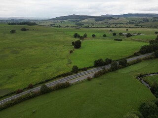 Aerial view of green fields and countryside in Skipton North Yorkshire England. 