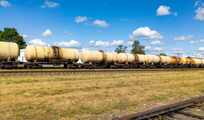 Railway tank cars used to transport petroleum products. Identification markings have been removed. The fuel train with petrochemical tank cars.
