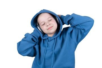 Little child with closed eyes and blissful expression listening to music through headphones wearing blue hoodie on transparent background