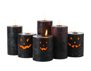 Halloween-themed lighted candles isolated on white background.