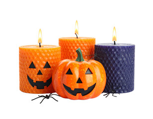 Halloween-themed lighted candles isolated on white background.