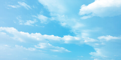 Fototapeta premium Blue clouds, sunny sunlight effect on the white fluffy clouds, rainy day, fresh natural weather background banner marketing image, surface splashed love day gift 