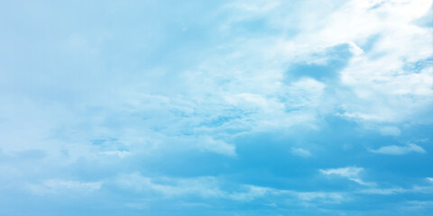 Fototapeta premium Blue clouds, sunny sunlight effect on the white fluffy clouds, rainy day, fresh natural weather background banner marketing image, surface splashed love day gift 