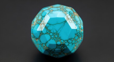 A faceted turquoise bead with a distinctive matrix pattern and vibrant bluegreen color
