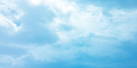 Blue clouds, sunny sunlight effect on the white fluffy clouds, rainy day, fresh natural weather background banner marketing image, surface splashed love day gift 