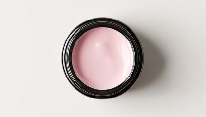 Pink cream in black jar, top view
