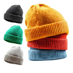 Various warm knitted hats in bright colors stacked together on a white background showcasing winter accessories