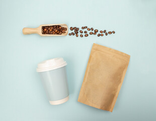 Top view. Flat lay.  coffee beans entering a takeaway cup, ideal for promotional or business design purposes