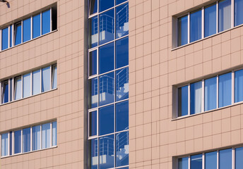 Cityscape on a sunny day, modern buildings and houses 