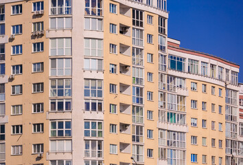 Cityscape on a sunny day, modern buildings and houses 