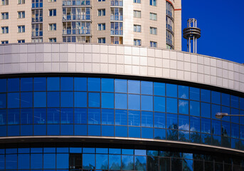 City view, modern buildings and skyscrapers against the blue sky.