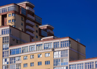 Fototapeta premium Cityscape on a sunny day, modern buildings and houses 