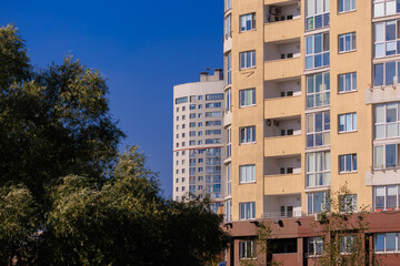 Cityscape on a sunny day, modern buildings and houses 