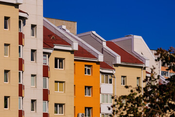 Cityscape on a summer day, modern buildings and houses 