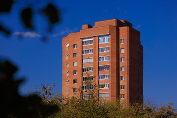 Cityscape on a sunny day, modern buildings and houses 
