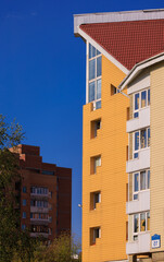 Cityscape on a sunny day, modern buildings and houses 