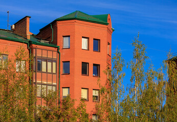 Cityscape on a sunny day, modern buildings and houses 