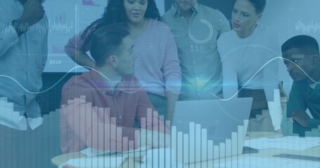 Collaborating team reviewing charts at conference room table, with laptop and digital overlays