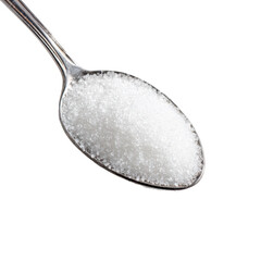 Close-up view of a metal spoon filled with granulated white sugar against a plain background during a kitchen preparation