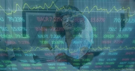 Analyzing female analyst wearing clear glasses monitoring stock tickers on laptop in tech office