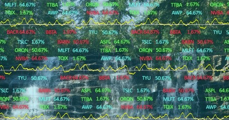 Projecting waterfall cascade streaming down mossy rock face at forested ravine, with data overlay