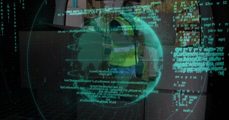 Site worker wearing safety vest interacting with holographic globe behind glass panel in interior