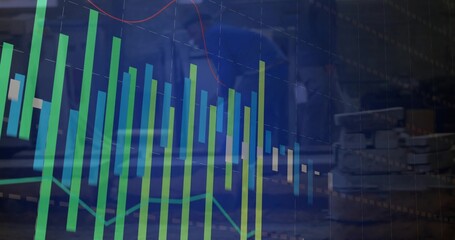 Overlaying financial chart on office desk, with electronics showing bars, trendline, cables, boards