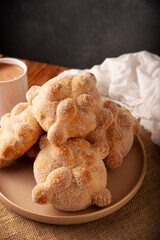 Pan de Muerto. Traditional Mexican sweet bread that is consumed in the season of the day of the dead. It is a main element in the altars and offerings in the festivity of Dia de Muertos in Mexico.